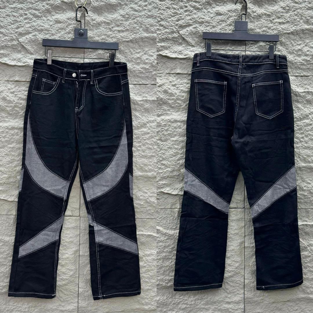 Black contrast panel baggy jeans shown in front and back views on hanger.