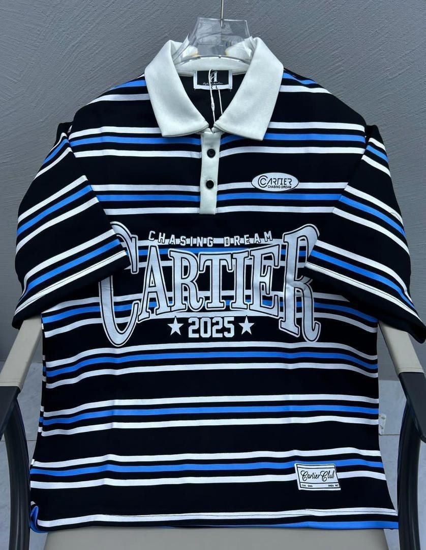 Black striped polo shirt with white and blue lines, white collar, and large Cartier graphic.