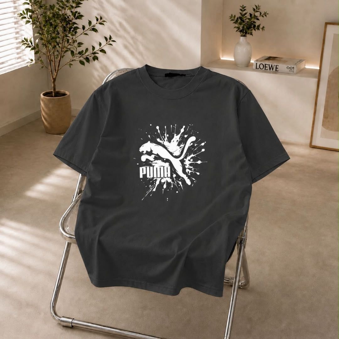 Dark gray t-shirt with white Puma splash logo on the chest.
