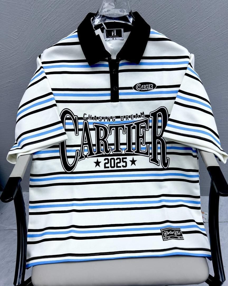White striped polo shirt with black and blue lines, black collar, and large Cartier graphic.