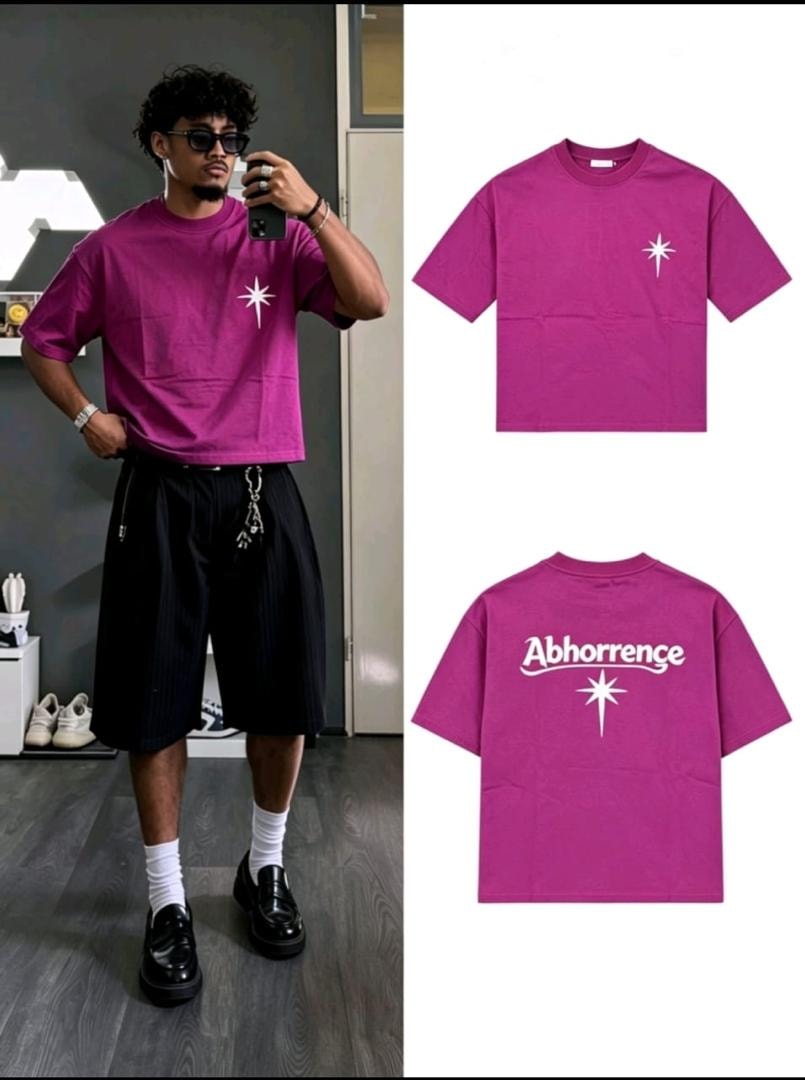 Purple t-shirt with small star on chest and Abhorrence graphic on back.
