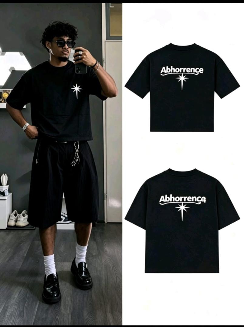 Black t-shirt with Abhorrence and star print on front and back.