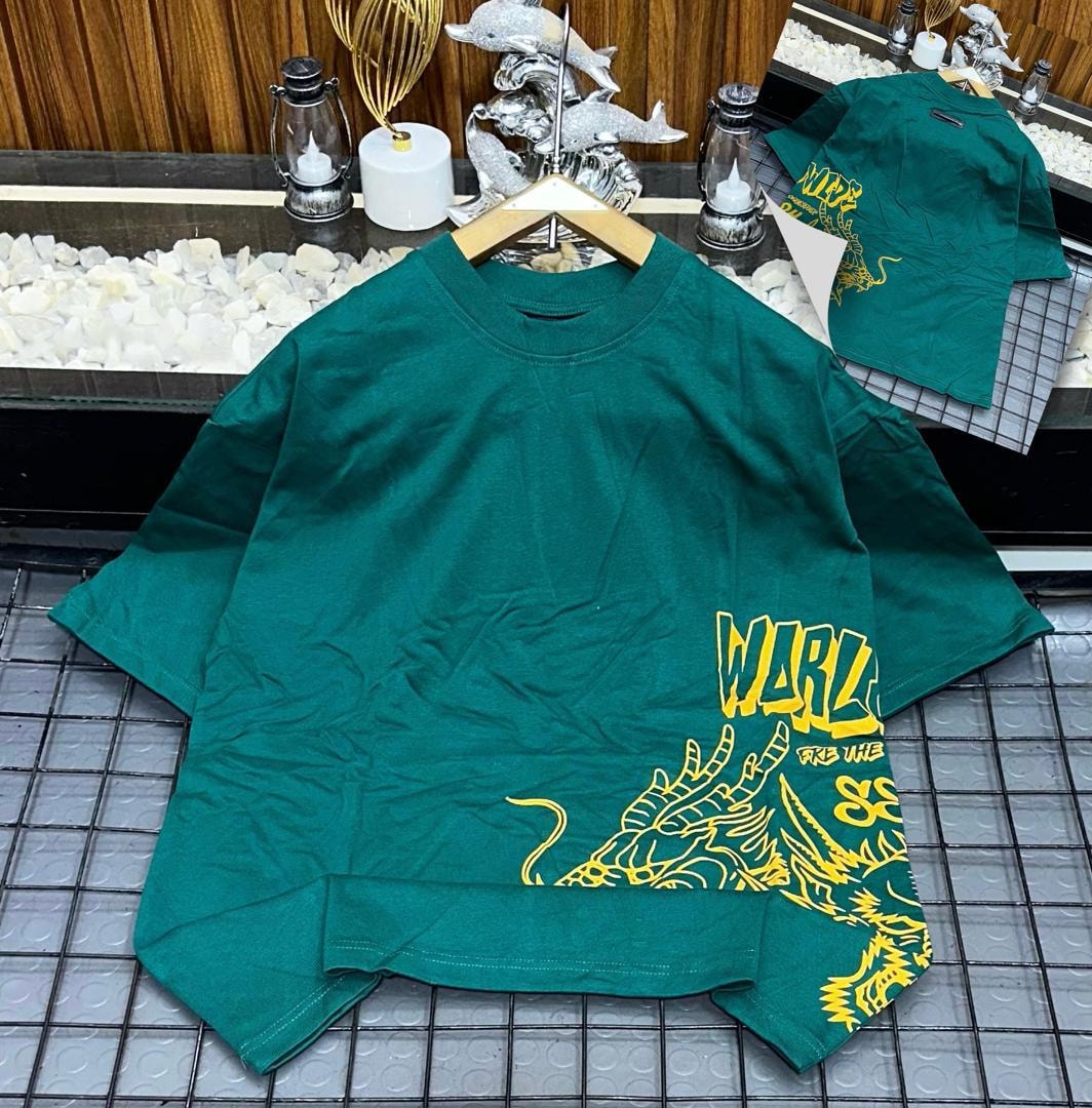 Green oversized t-shirt with yellow dragon and WARLZ graphic on front, shown on hanger with back inset.