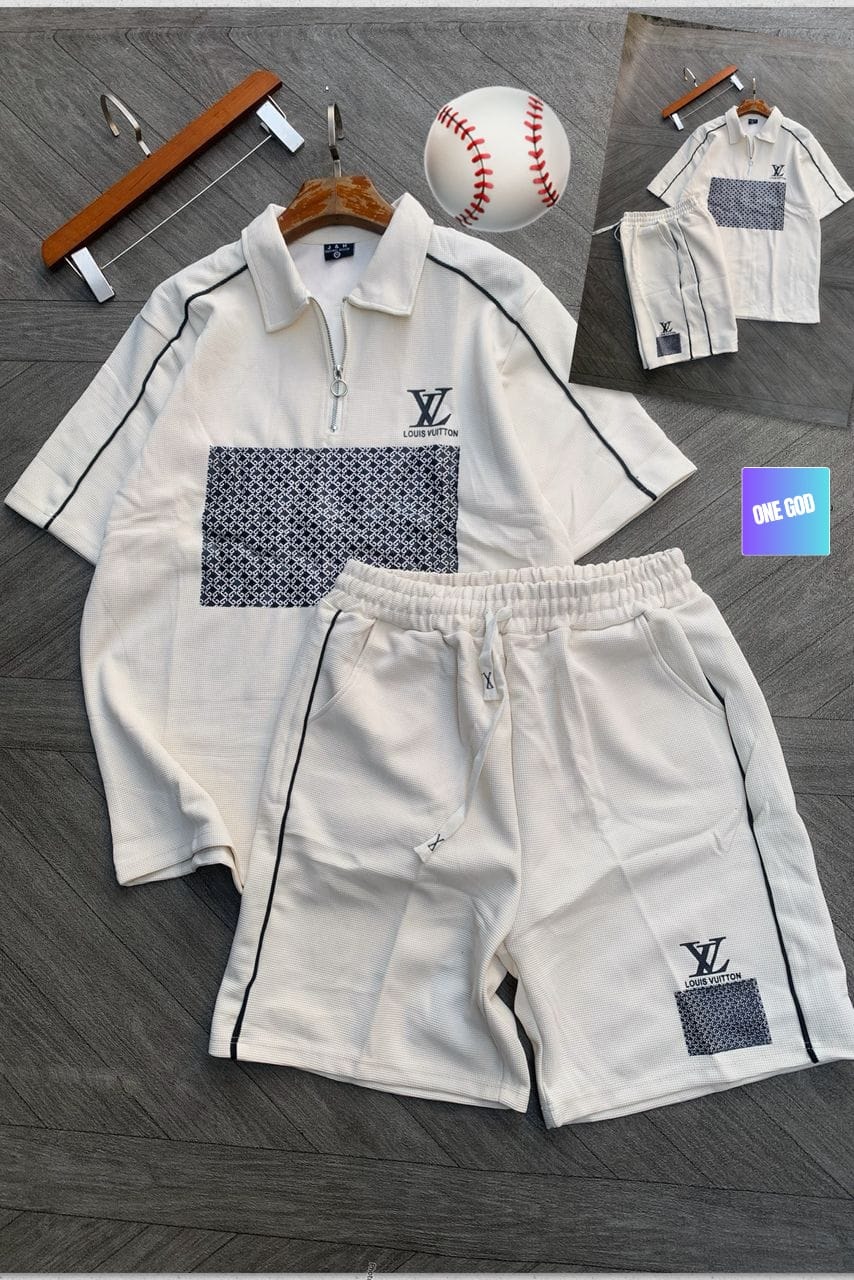 Cream two-piece polo shirt and shorts set with black piping, LV logo embroidery and monogram panel.