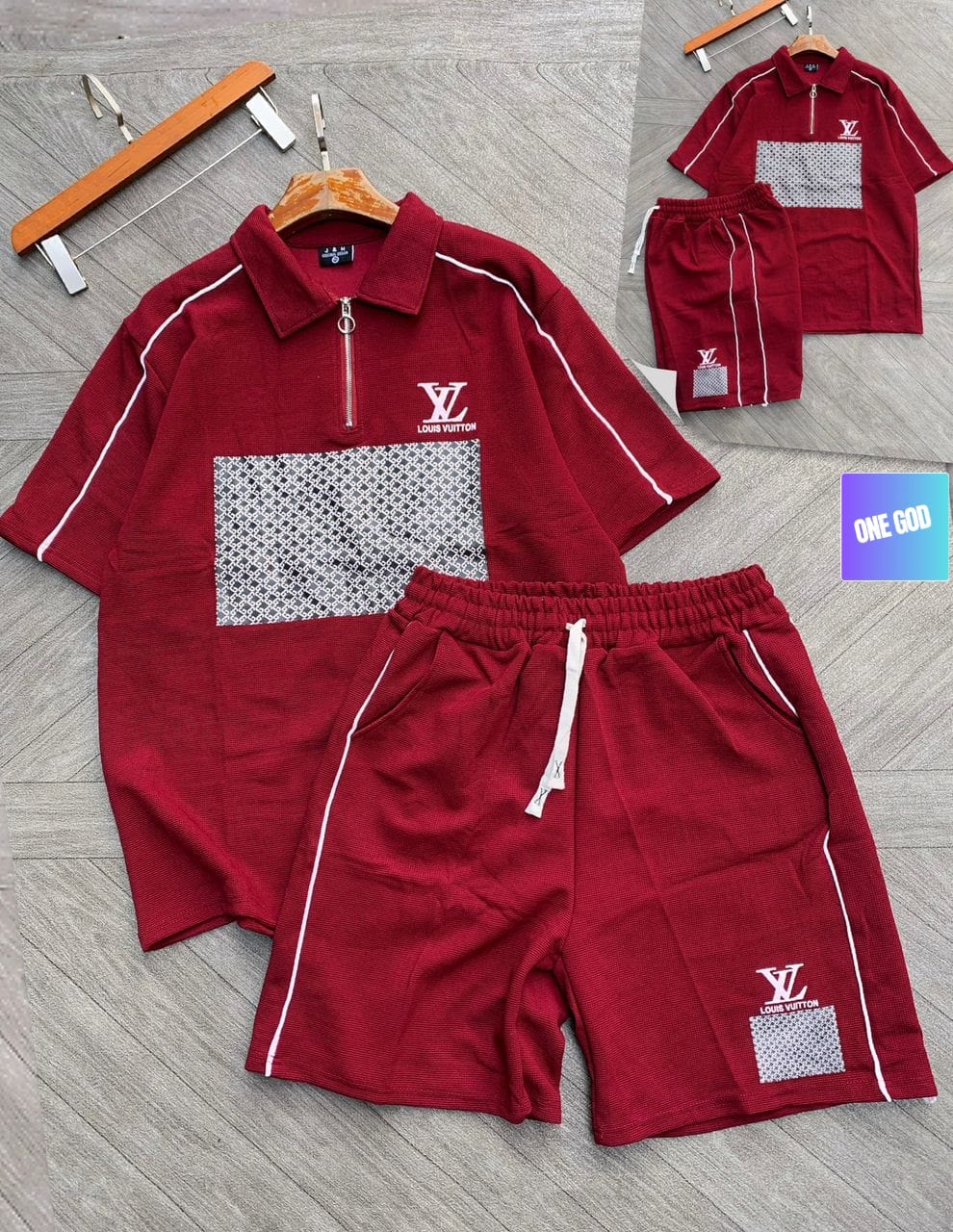 Burgundy two-piece polo shirt and shorts set with LV logo and monogram panel, shown flat on wooden floor with hanger.