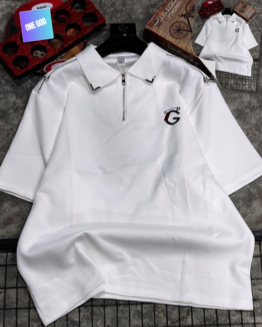White quarter-zip polo with shoulder zips and embroidered logo on grey background.