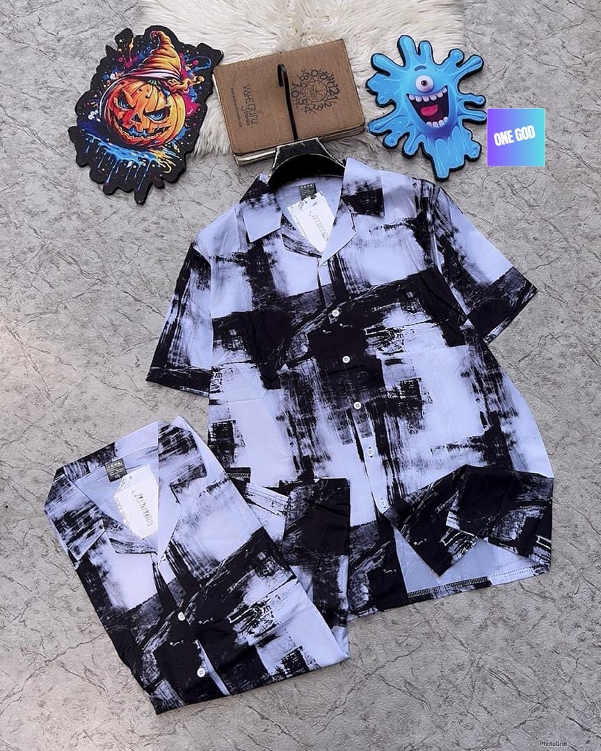 Black and white abstract brushstroke pattern short sleeve button-up shirt displayed with folded view.