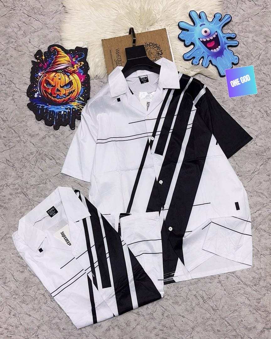 White short sleeve shirt with black geometric stripes and lines, shown hanging and folded.