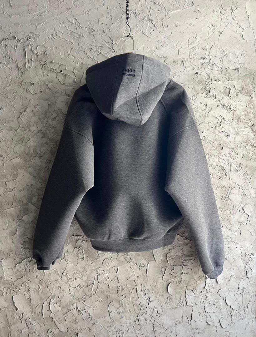Back view of gray zip-up hoodie showing made extreme embroidery on hood.