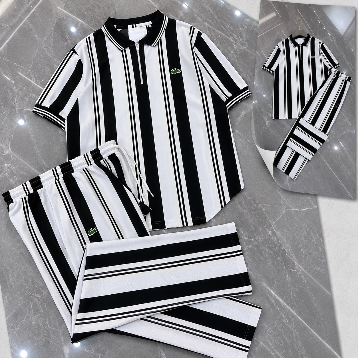 Lacoste black and white striped two-piece set with polo shirt and trousers.