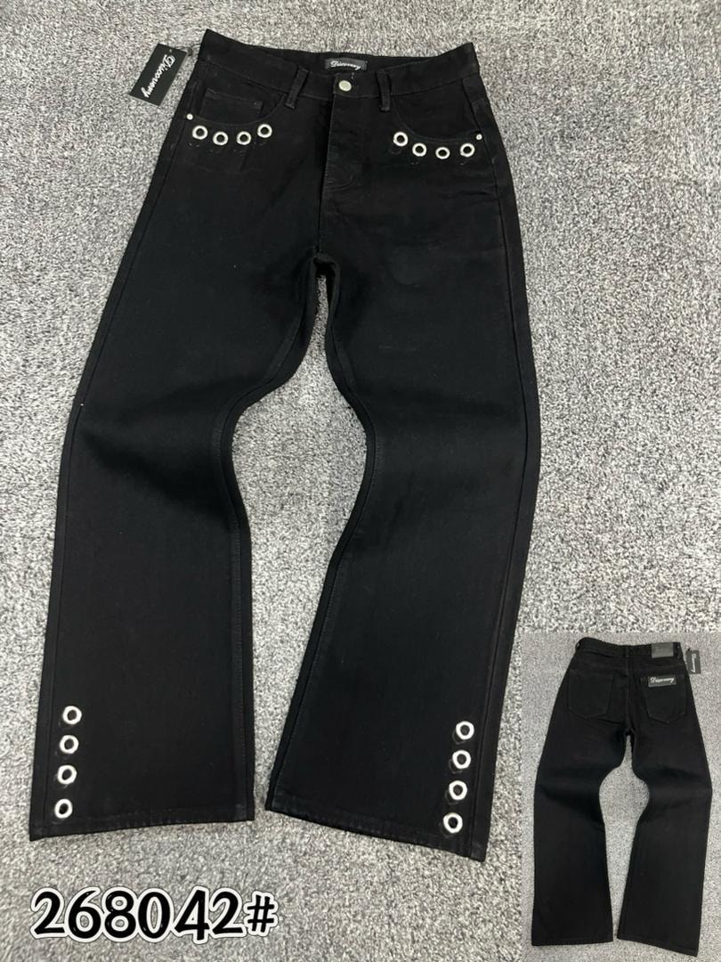 Black jeans with circular silver eyelets on back pockets and legs displayed flat with inset views.