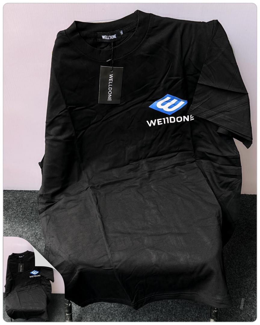 Black Welldone logo t-shirt showing blue and white chest graphic.
