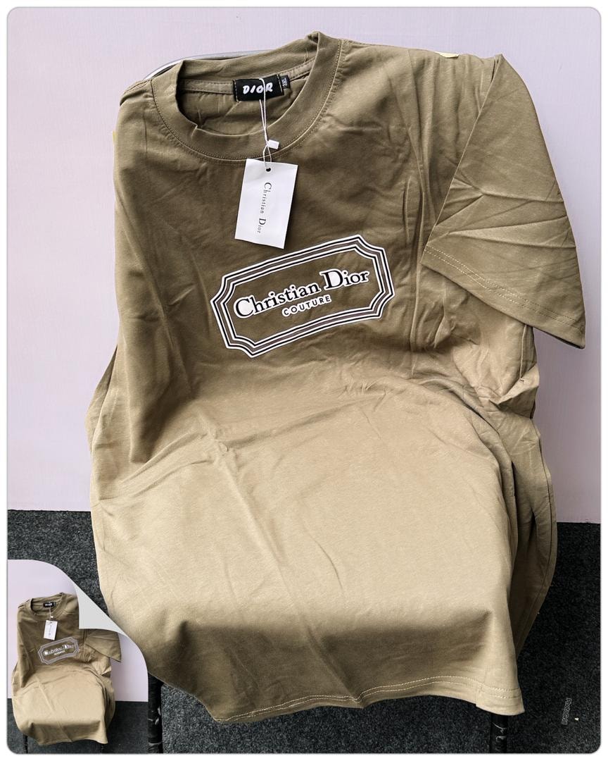 Beige Christian Dior Couture logo t-shirt laid flat showing front print.