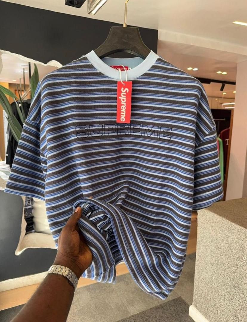 Supreme striped t-shirt in blue colorway with chest logo.