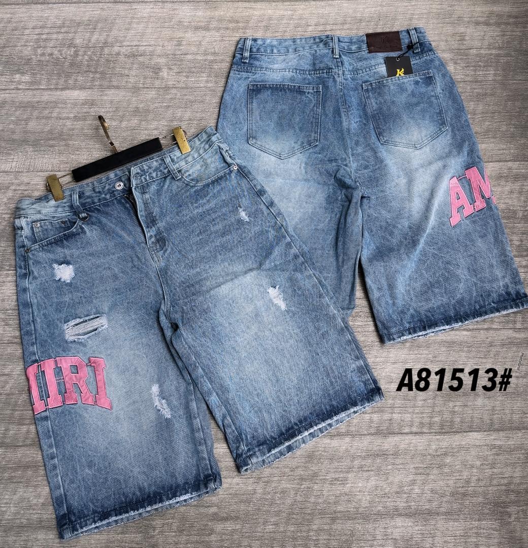 Light blue distressed baggy denim jorts with pink embroidery, front and back views.