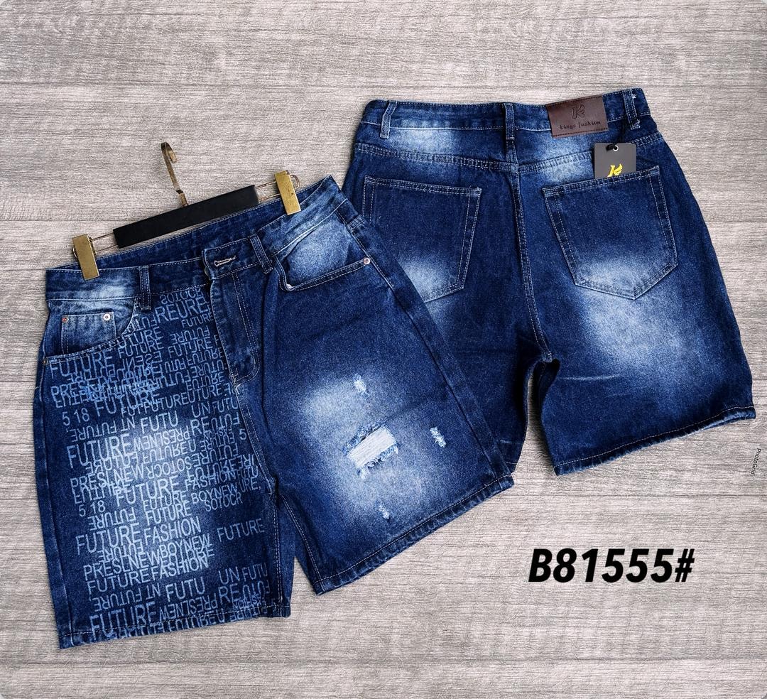 Dark blue baggy denim jorts with all-over text print, front and back views with minor rips.