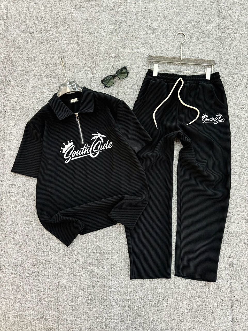 Black ribbed zip-up polo shirt and jogger pants with white South Side crown and palm logo.