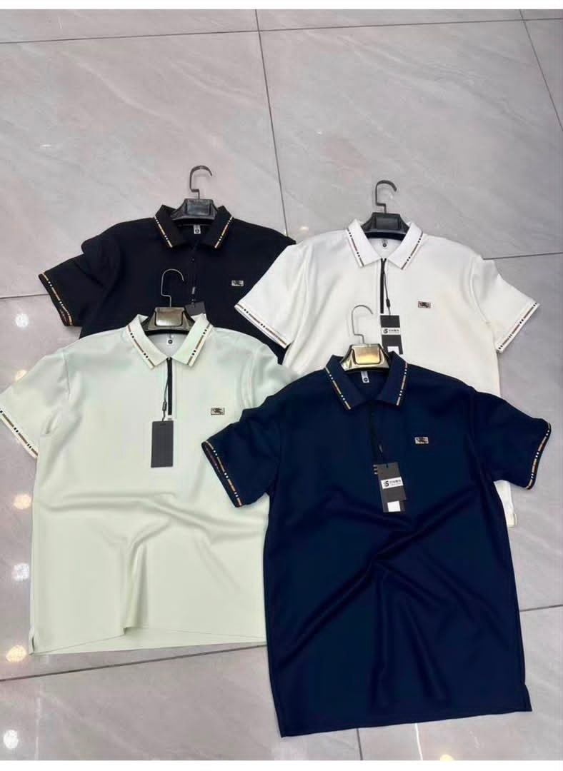 Four polo shirts with chest logos and contrast trim in black, white, light green and navy.