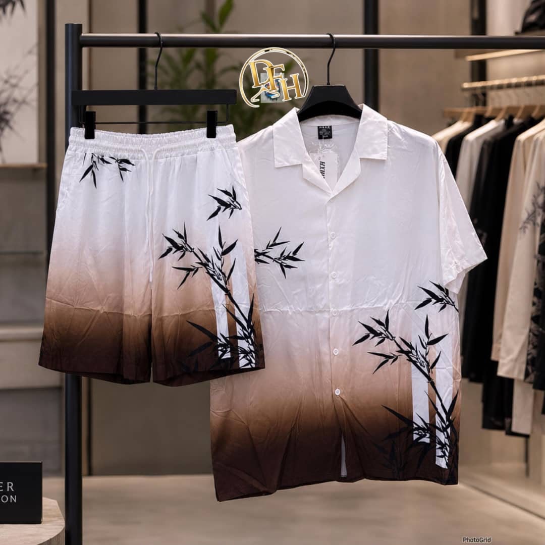 White to brown ombre short sleeve shirt and shorts set with black bamboo prints on rack.