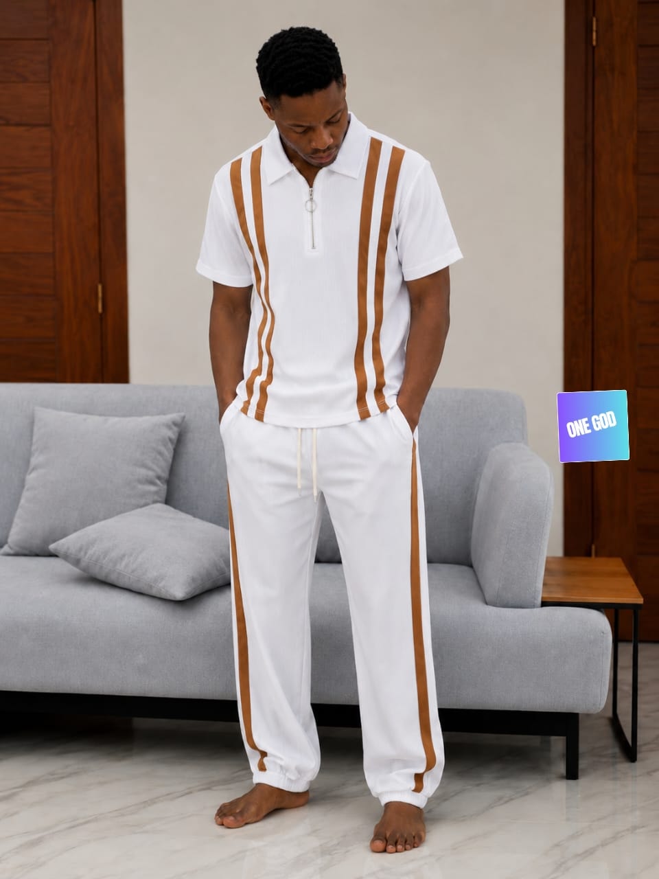 Man modeling white and brown striped ribbed two-piece set