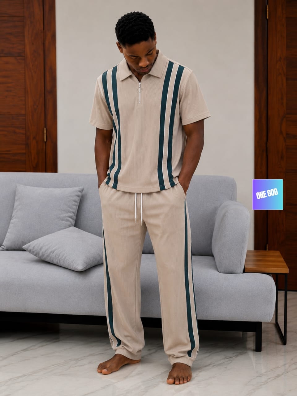 Man modeling beige and teal striped ribbed two-piece set