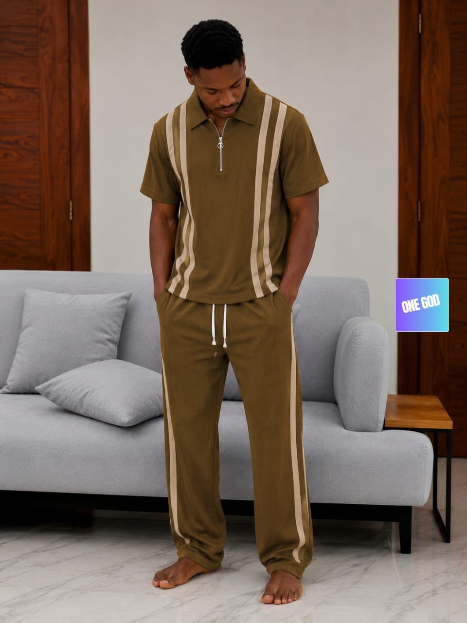 Man modeling olive and cream striped ribbed two-piece set