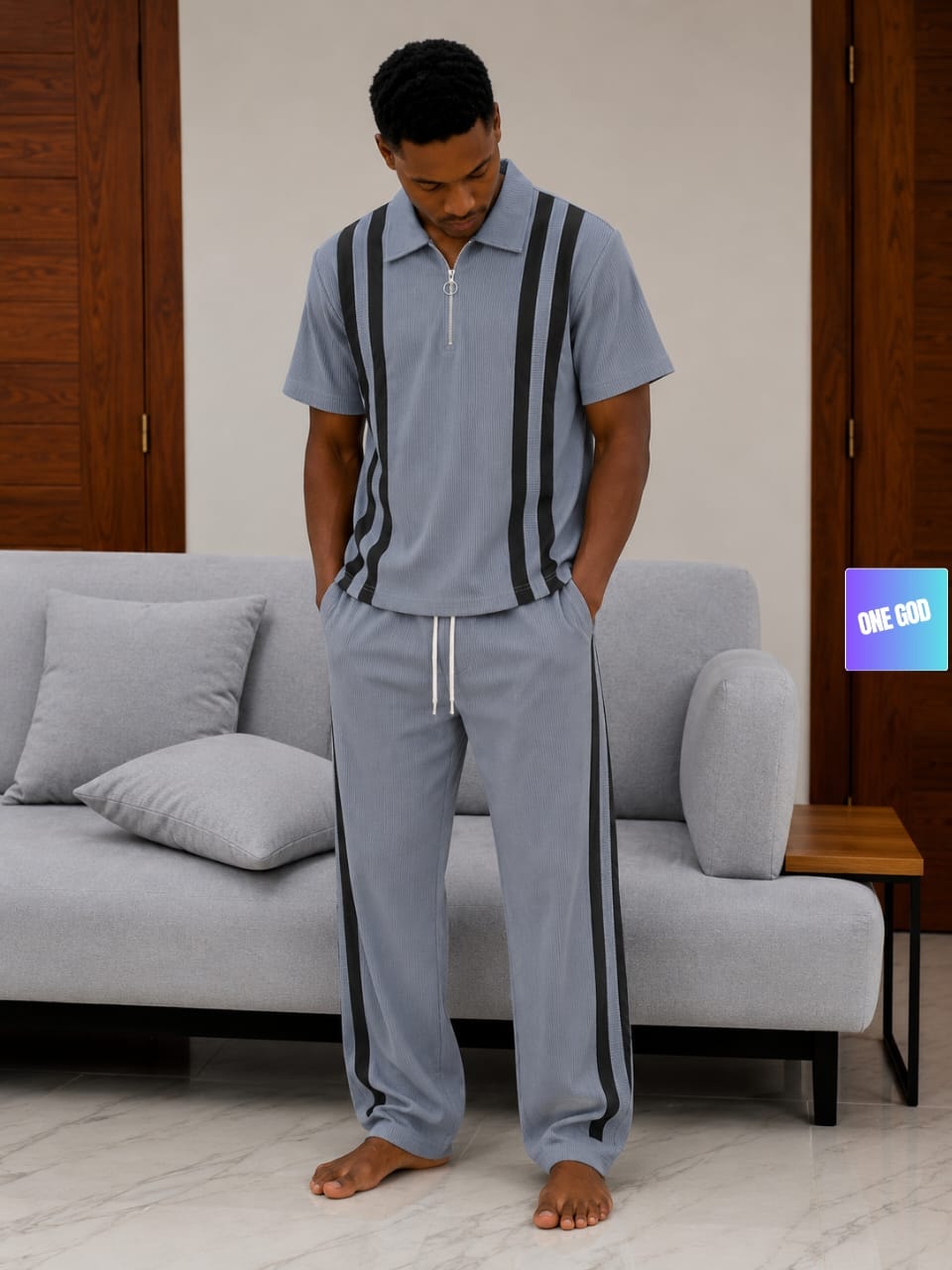 Man modeling light blue and black striped ribbed two-piece set