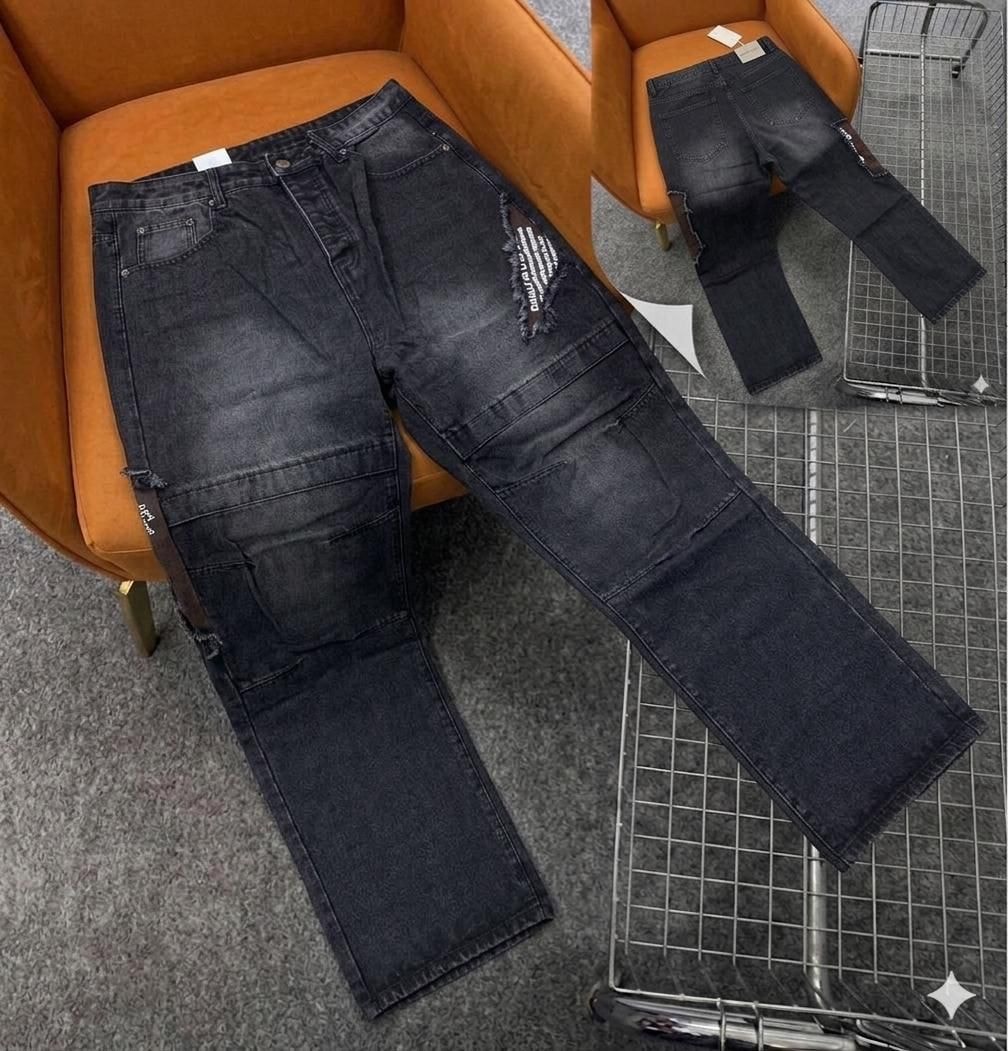 Black cargo baggy jeans with large thigh pockets and knee rip details.
