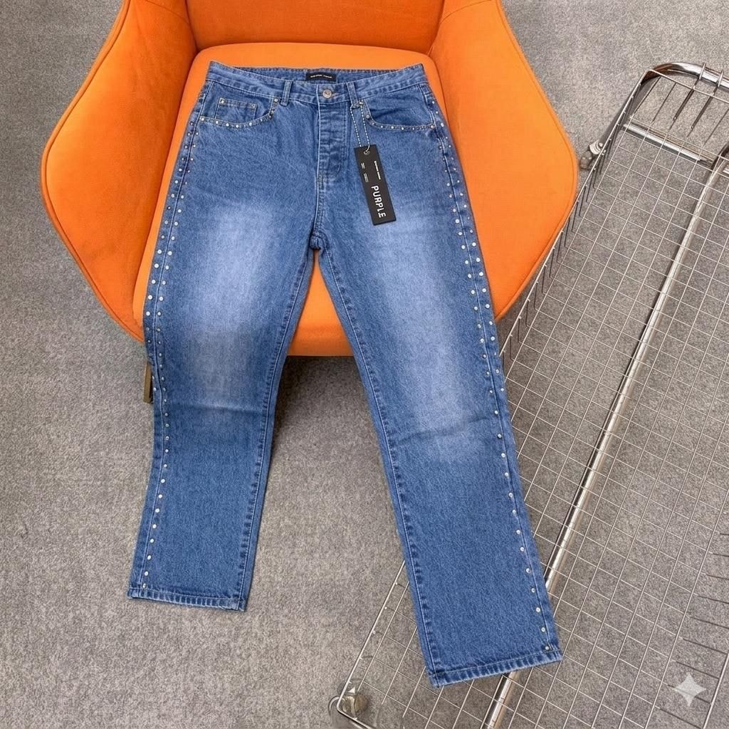 Light blue jeans with silver studs along outer side seams.
