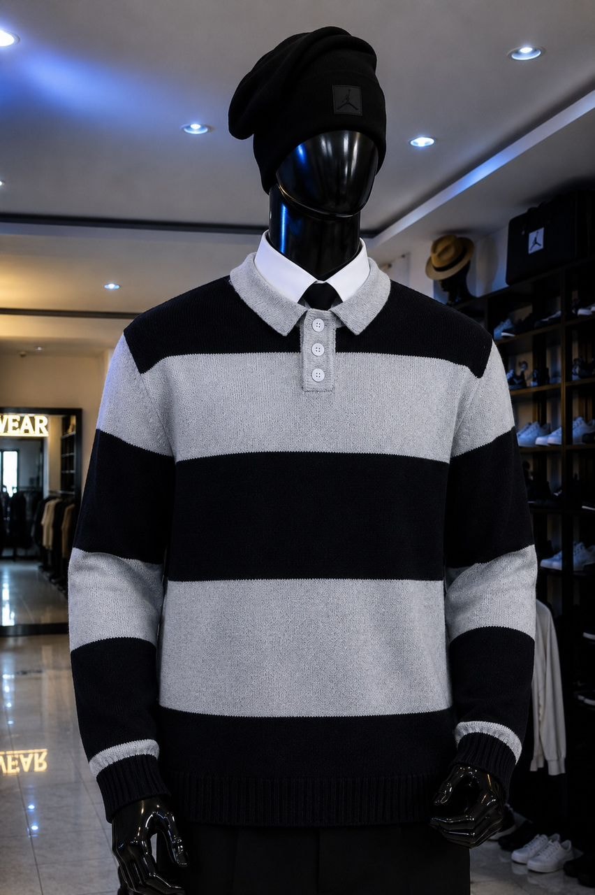 Mannequin in black and gray striped knit polo top with collared shirt and beanie.
