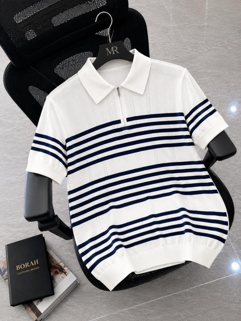 Borah white horizontal striped quarter-zip polo shirt on black office chair beside brand box.