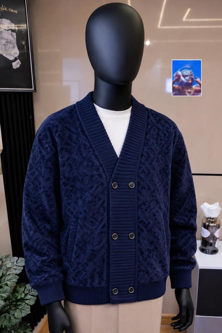 Mannequin wearing navy monogram cardigan with button front and ribbed trims.