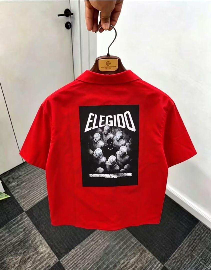 Back view of red short sleeve shirt showing ELEGIDO graphic print.