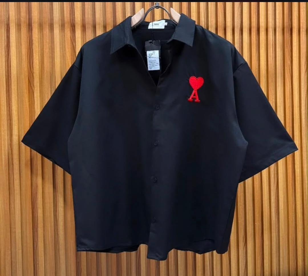 Black short sleeve shirt with red heart and A embroidery on chest.