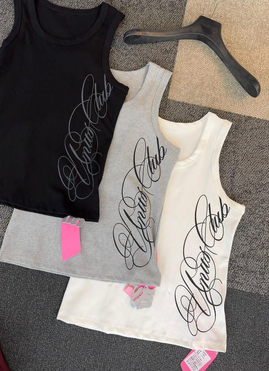 Close-up of black, grey and white armless tank tops with matching cursive script designs.