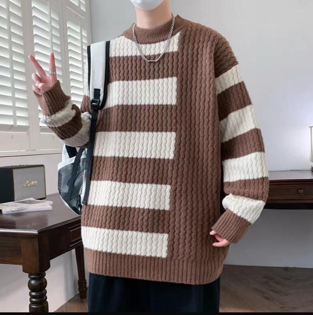 Model wearing brown and white striped chunky knit sweatshirt with backpack.