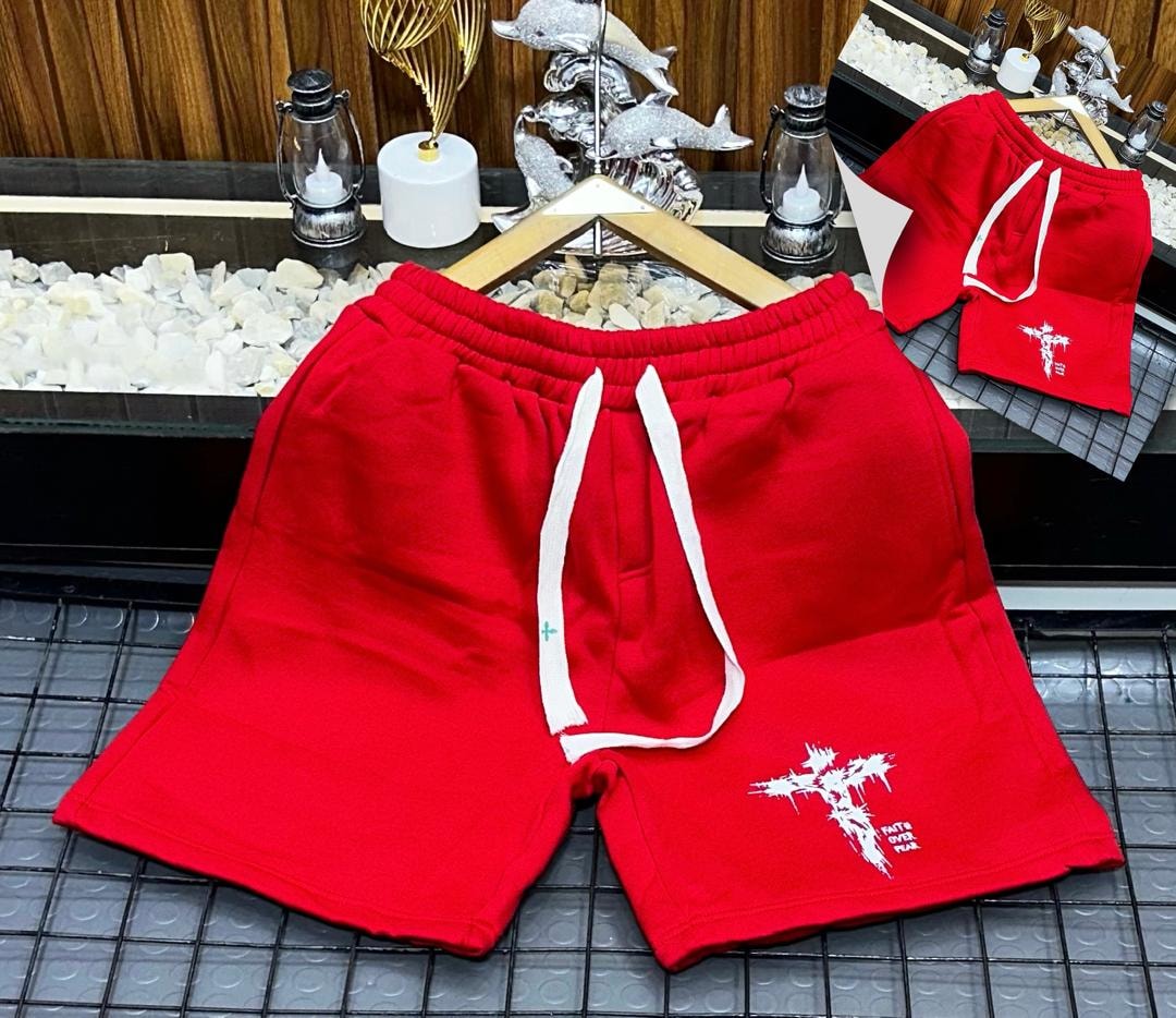 Red fleece shorts with white cross and Faith Over Fear print.
