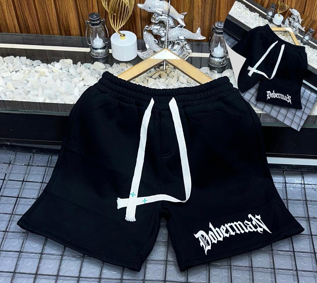 Black fleece shorts with Doberman gothic print on the leg.