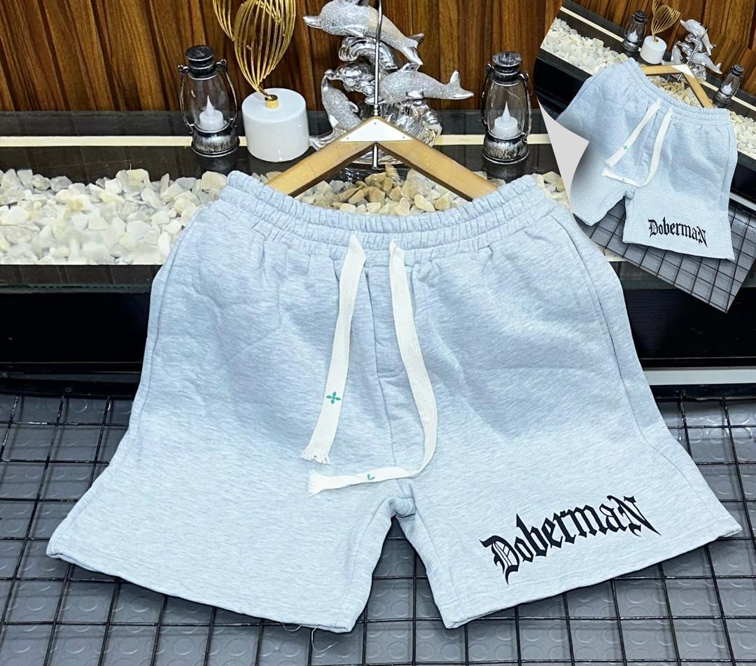 Light gray fleece shorts with Doberman gothic print on the leg.