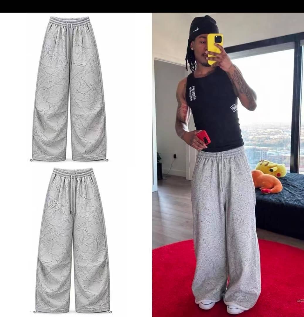 Light gray marble pattern wide-leg joggers shown in flat lay and worn by model.