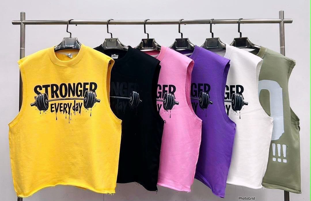 Six cropped armless tees in yellow, black, pink, purple, white and olive with Stronger Every Day barbell graphic.