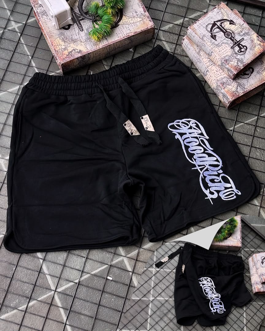 Black HoodRich fleece shorts with white embroidery and drawstring waist.