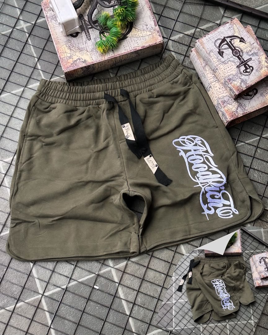Olive HoodRich fleece shorts with white embroidery and drawstring waist.