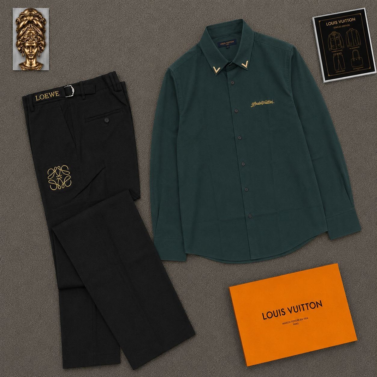 Green Louis Vuitton embroidered shirt paired with black Loewe trousers in flat lay.