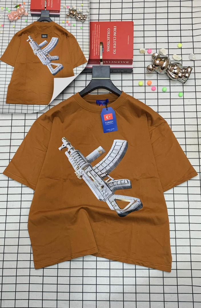 Orange oversized t-shirt with jeweled AK-47 graphic on front and back.