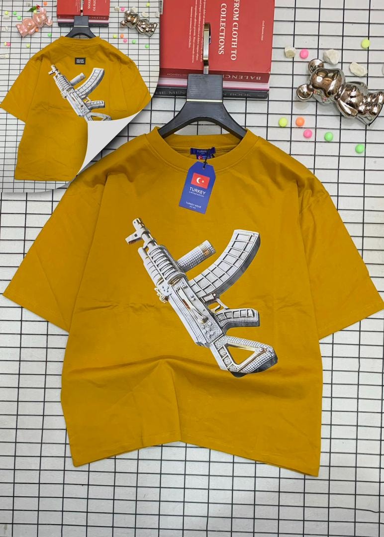 Yellow oversized t-shirt with jeweled AK-47 graphic on front and back.