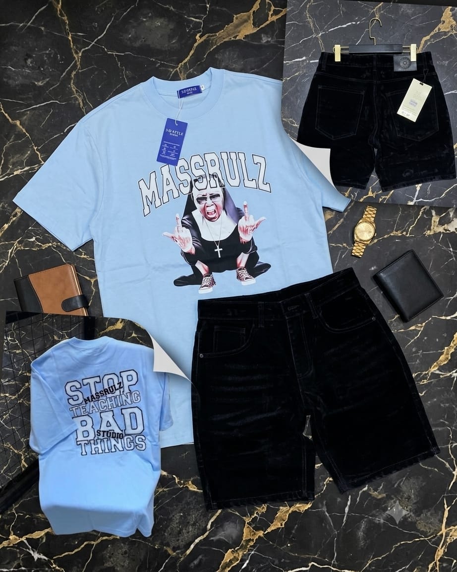 Light blue t-shirt with MASSRULZ nun graphic and black velvet shorts, showing back print view and styled with accessories on marble background.