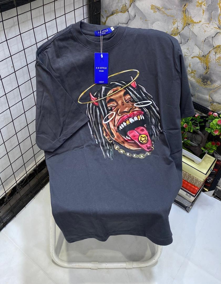 Dark gray t-shirt with devil angel face graphic featuring horns, halo and chain.