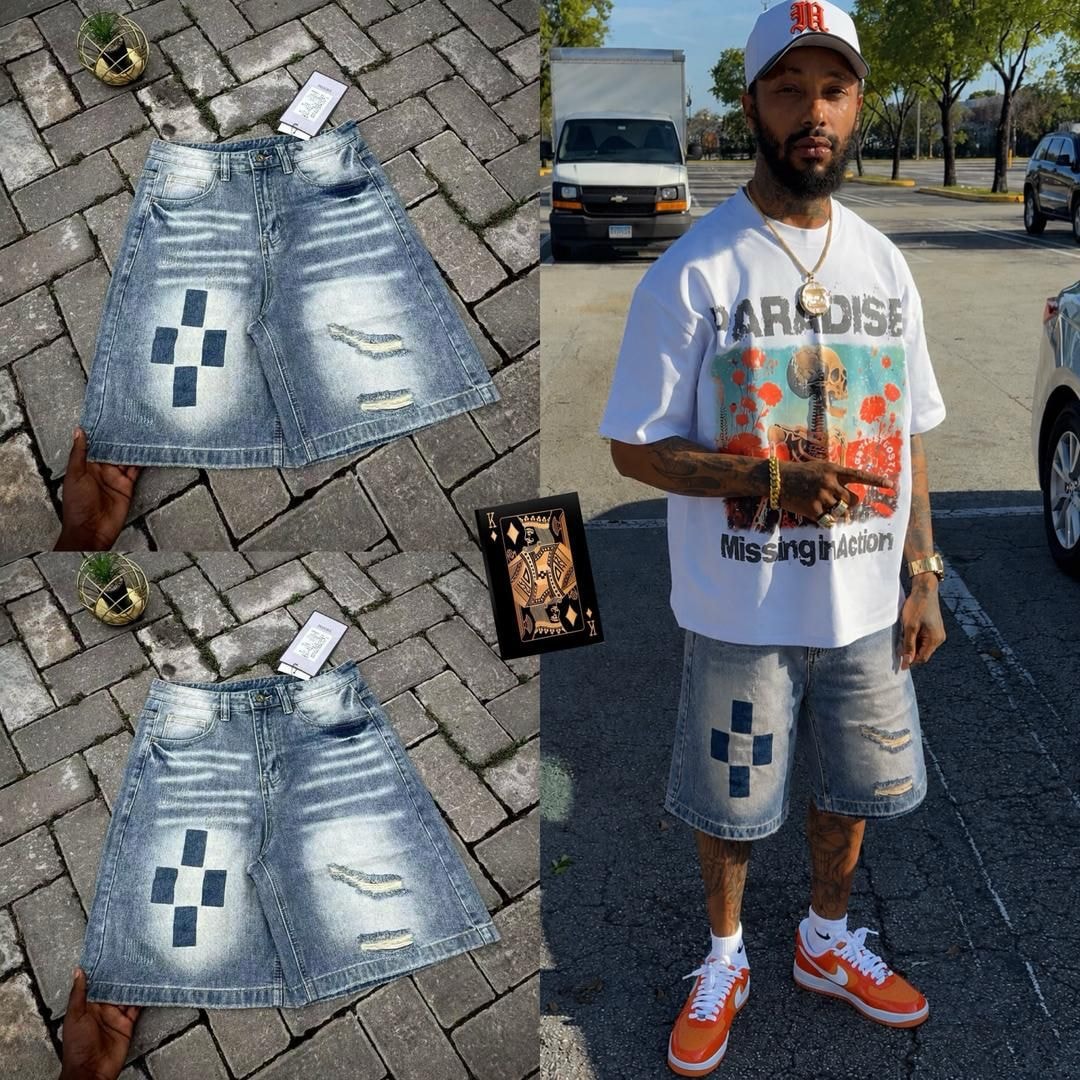 Outdoor shots of man in white graphic tee paired with faded ripped denim jorts featuring square pattern.