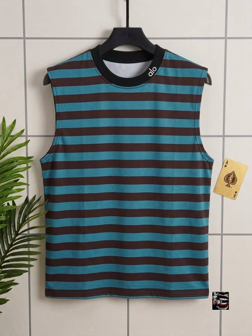 Turquoise and brown striped sleeveless top with alo neck detail.